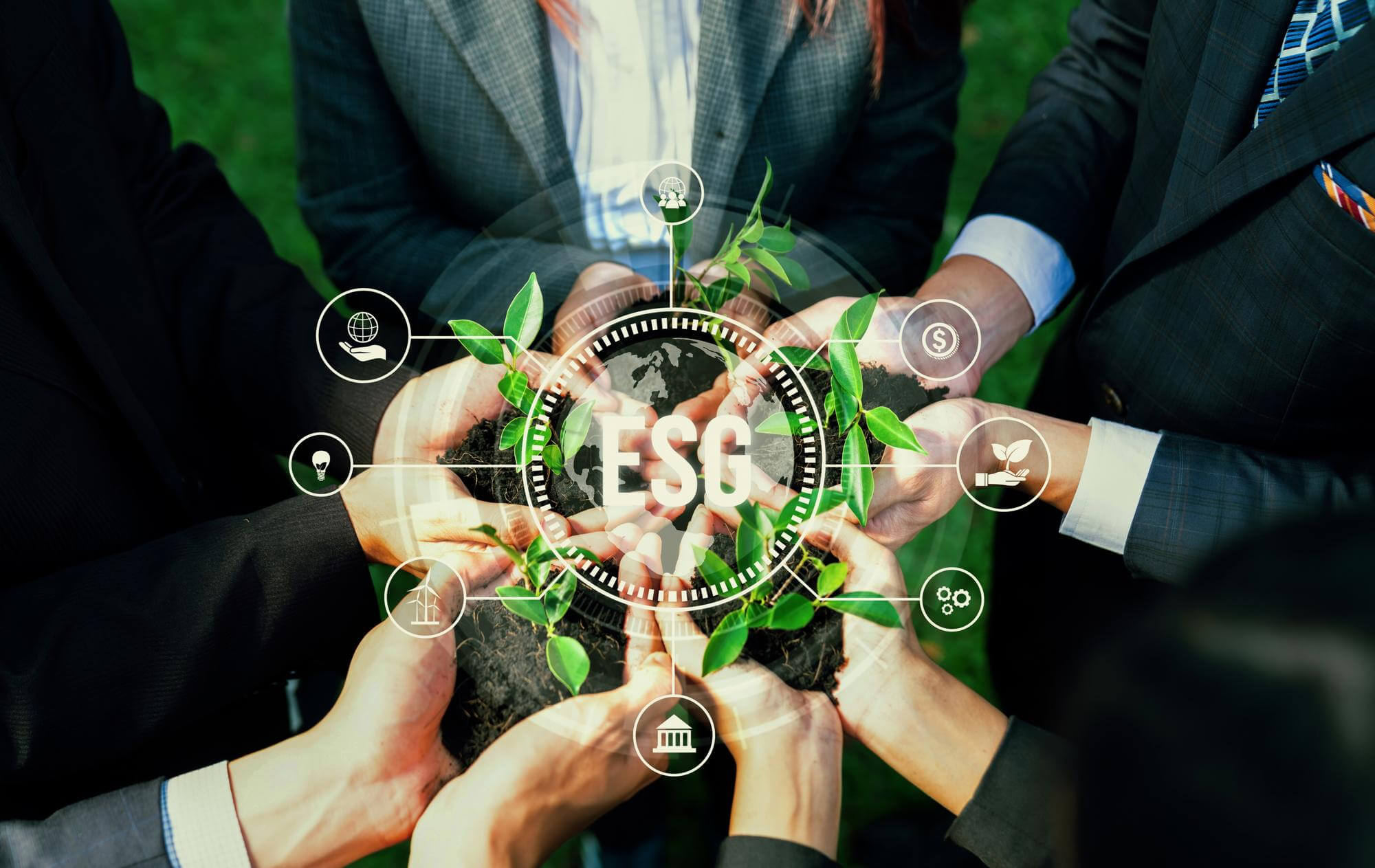 A group of business people holding plants with ESG icons.